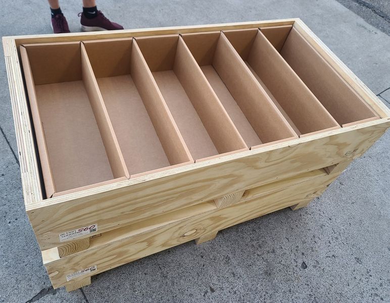 Wood crate with corrugated divider partitions