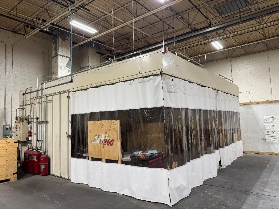 Custom 24 by 24 foot paint booth with white curtain walls
